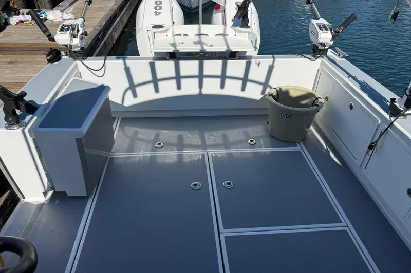 Hardy Yacht Photos Pics 2020 Coastal Craft 33 ProFish boat deck with fishing gear and storage.