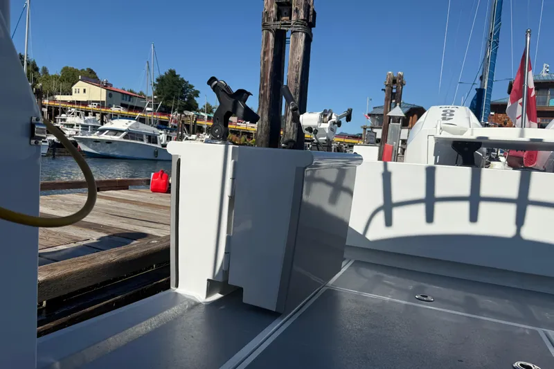 Hardy Yacht Photos Pics 2020 Coastal Craft 33 ProFish docked at marina, showcasing fishing rod holders and deck.
