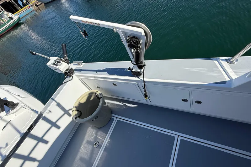 Hardy Yacht Photos Pics 2020 Coastal Craft 33 ProFish boat deck with fishing equipment and storage compartments.