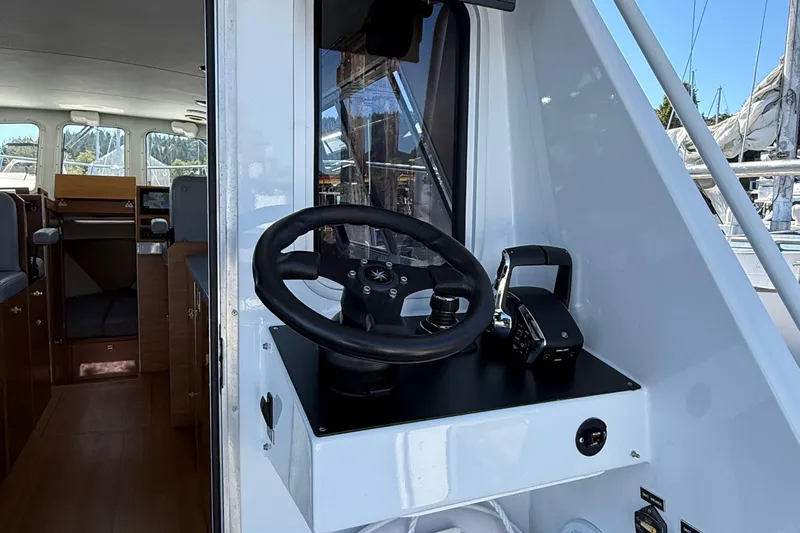 Hardy Yacht Photos Pics 2020 Coastal Craft 33 ProFish helm with steering wheel and throttle controls.