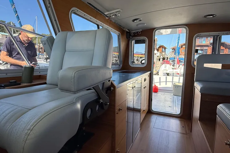 Hardy Yacht Photos Pics Interior of 2020 Coastal Craft 33 ProFish boat with modern seating and cabinetry.