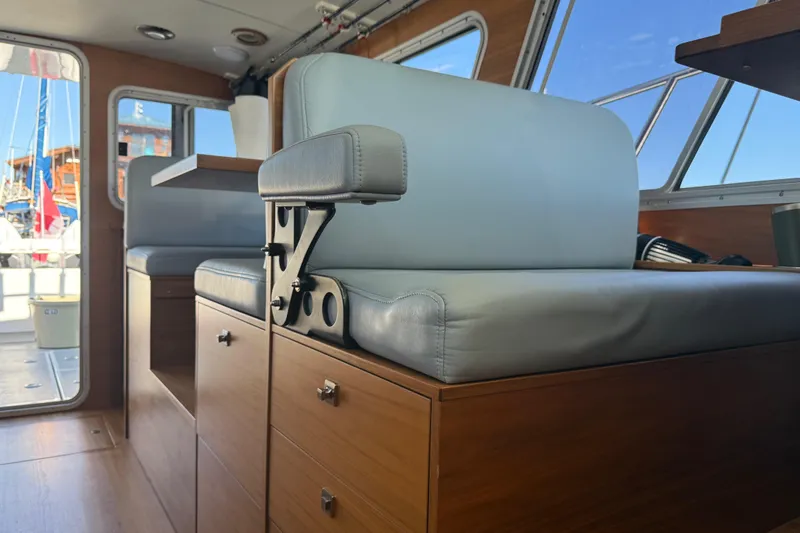 Hardy Yacht Photos Pics Interior of 2020 Coastal Craft 33 ProFish with modern seating and wooden cabinetry.