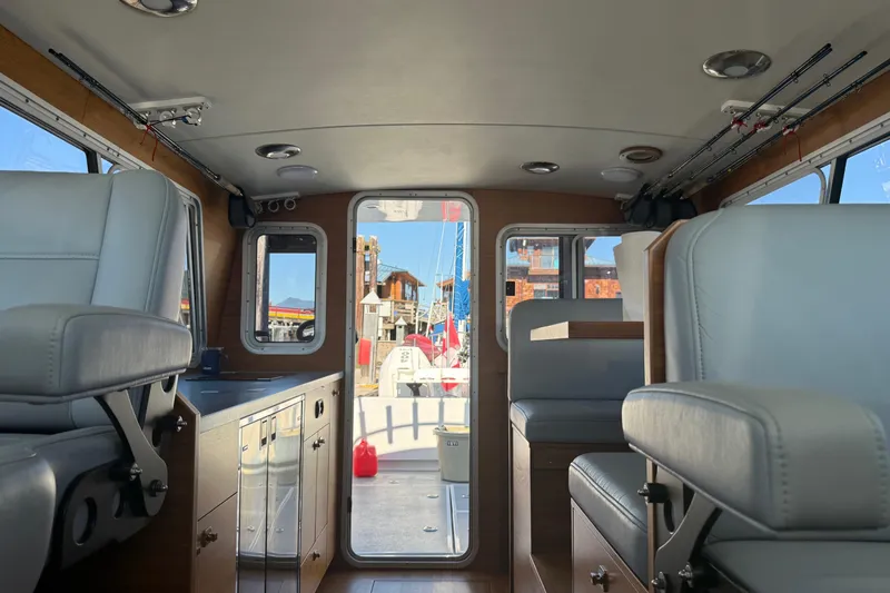 Hardy Yacht Photos Pics Interior of 2020 Coastal Craft 33 ProFish boat with seating and cabinetry.