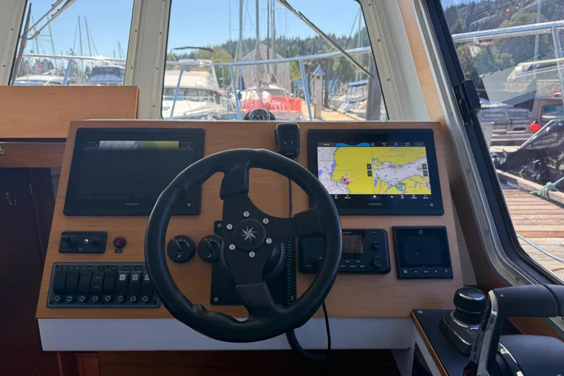 Hardy Yacht Photos Pics Cockpit of 2020 Coastal Craft 33 ProFish with navigation screens and steering wheel.