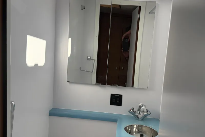 Hardy Yacht Photos Pics Bathroom interior of 2020 Coastal Craft 33 ProFish with mirror and sink.