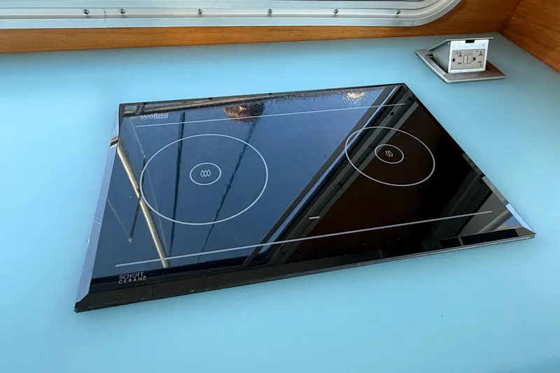 Hardy Yacht Photos Pics Modern induction cooktop on Coastal Craft 33 ProFish, 2020 model, with sleek design and integrated outlet.