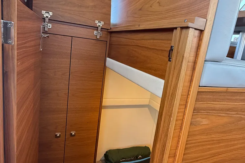 Hardy Yacht Photos Pics Interior view of 2020 Coastal Craft 33 ProFish, featuring wooden cabinetry and seating.