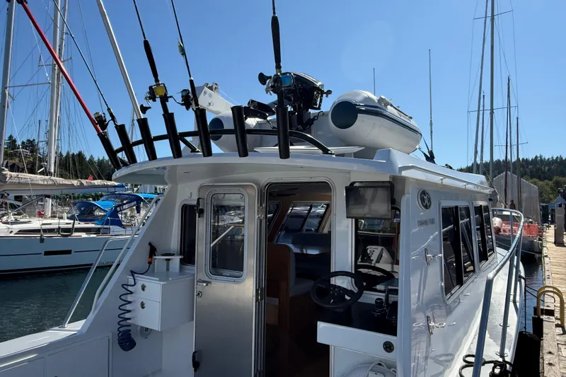 Hardy Yacht Photos Pics 2020 Coastal Craft 33 ProFish boat docked, featuring fishing rods and equipment.
