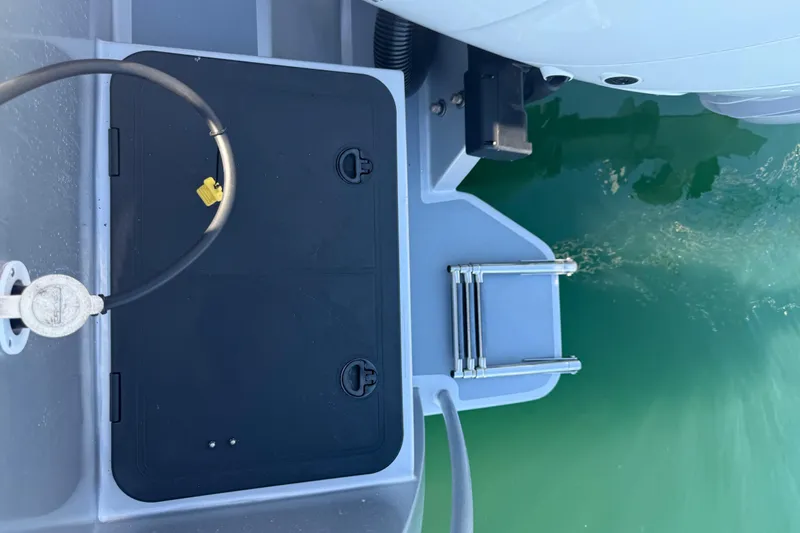 Hardy Yacht Photos Pics 2020 Coastal Craft 33 ProFish boat deck with ladder and water view.