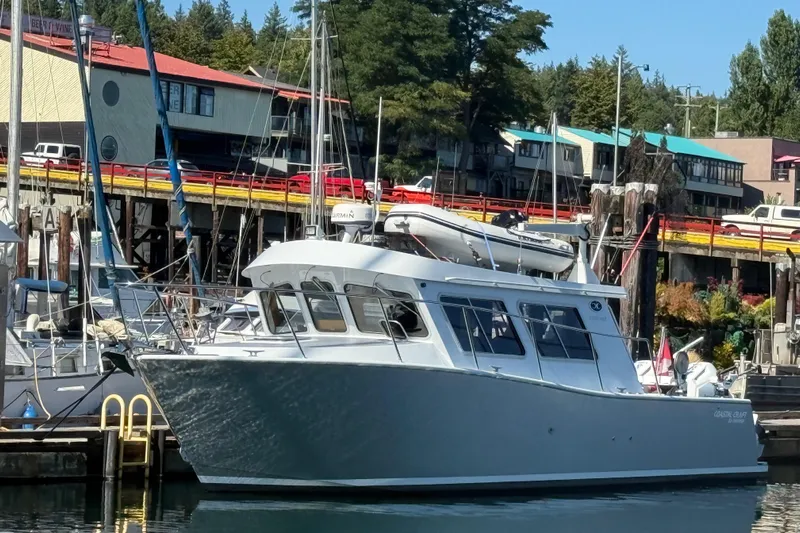 Hardy Yacht Photos Pics 2020 Coastal Craft 33 ProFish boat docked in a marina, surrounded by other vessels.