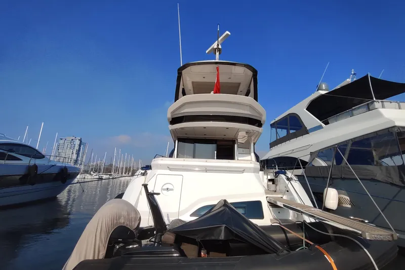 Prn Yacht Photos Pics Azimut Fly 53 yacht, 2022 model, docked at a marina under clear blue skies.