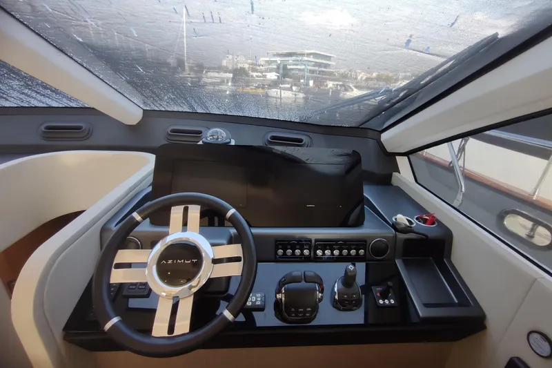 Prn Yacht Photos Pics Cockpit of 2022 Azimut Fly 53 yacht with modern steering and controls.