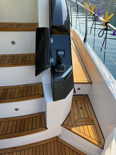  Yacht Photos Pics Staircase on 2023 Azimut Fly 53 yacht with teak decking and control panel.