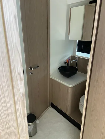  Yacht Photos Pics Modern bathroom interior on 2023 Azimut Fly 53 yacht, featuring sleek design and fixtures.