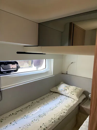  Yacht Photos Pics 2023 Azimut Fly 53 yacht cabin with single bed and window view.