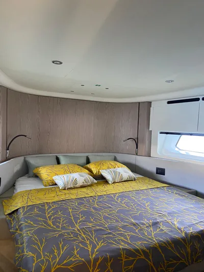  Yacht Photos Pics Luxurious bedroom interior of 2023 Azimut Fly 53 yacht with elegant bedding and modern design.