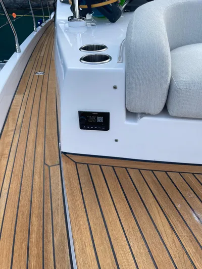  Yacht Photos Pics 2023 Azimut Fly 53 yacht deck with teak flooring and cushioned seating.