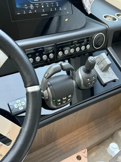  Yacht Photos Pics Control panel of 2023 Azimut Fly 53 yacht with steering wheel and navigation controls.