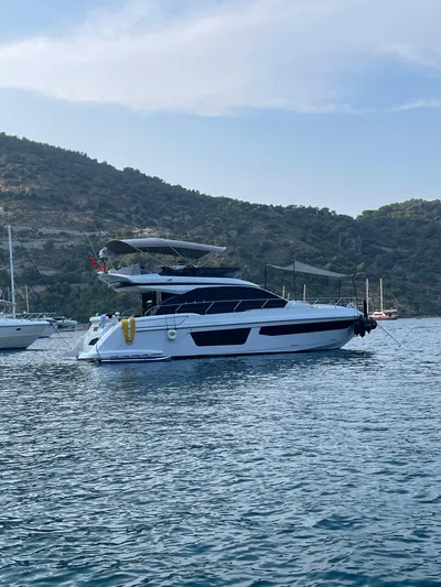  Yacht Photos Pics 2023 Azimut Fly 53 yacht anchored in scenic coastal waters.