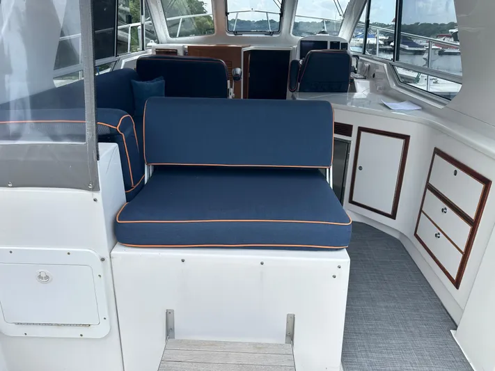  Yacht Photos Pics Interior of 2018 True North 34OE boat with blue seating and white cabinetry.