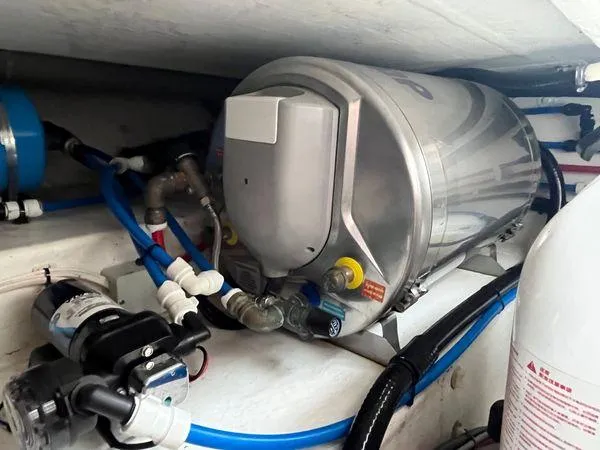  Yacht Photos Pics Water heater system in a 2018 True North 34OE boat, featuring pipes and connections.