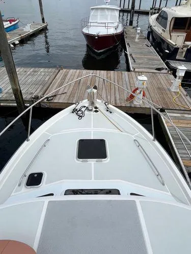  Yacht Photos Pics Bow view of 2018 True North 34OE boat docked at a marina.