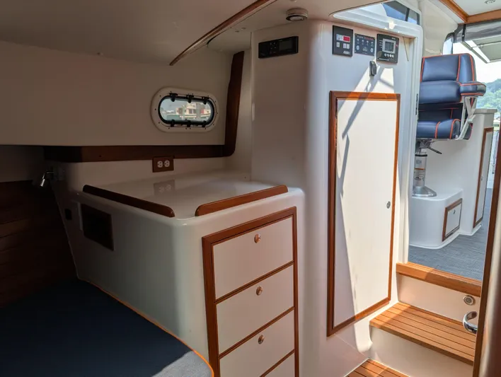  Yacht Photos Pics Interior of 2018 True North 34OE yacht with wood accents and modern controls.