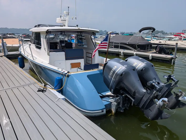  Yacht Photos Pics 2018 True North 34OE boat docked with twin Yamaha outboard motors.