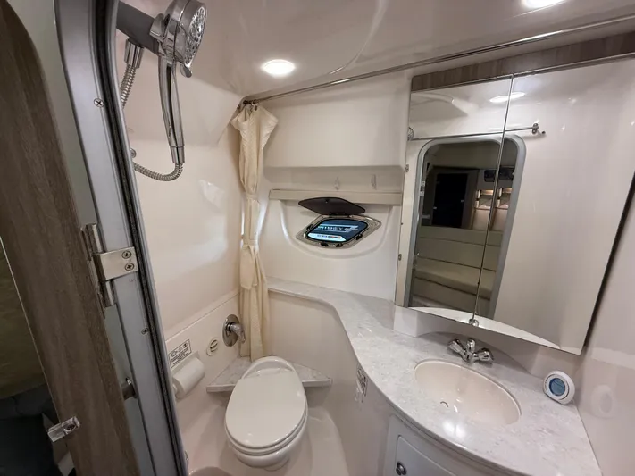 Social Distance Yacht Photos Pics 2019 Regal 35 Sport Coupe bathroom with modern fixtures and compact design.