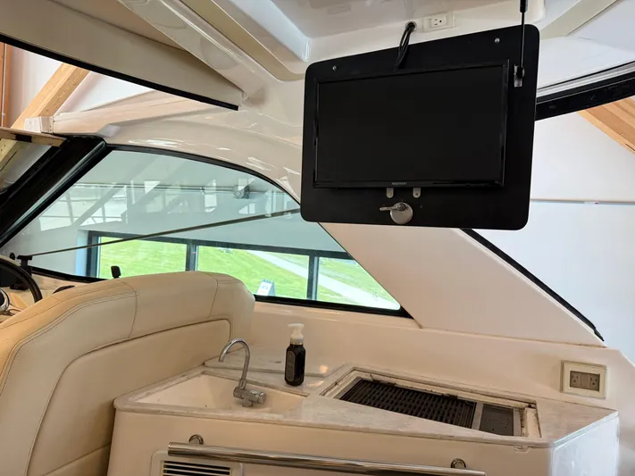 Social Distance Yacht Photos Pics Interior of 2019 Regal 35 Sport Coupe with sink and mounted TV.