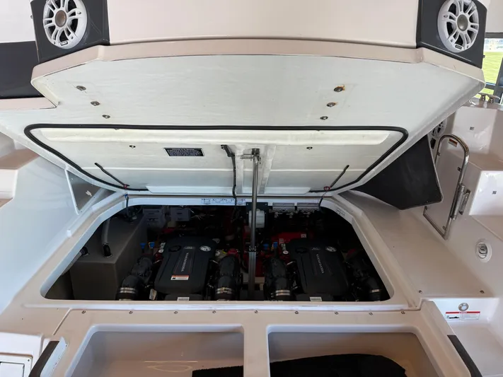 Social Distance Yacht Photos Pics 2019 Regal 35 Sport Coupe engine compartment with open hatch, showcasing dual engines.