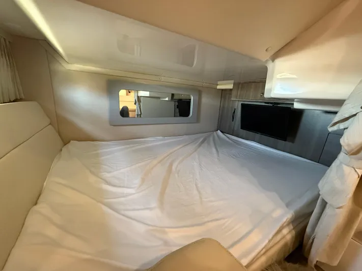 Social Distance Yacht Photos Pics 2019 Regal 35 Sport Coupe interior cabin with bed and TV.