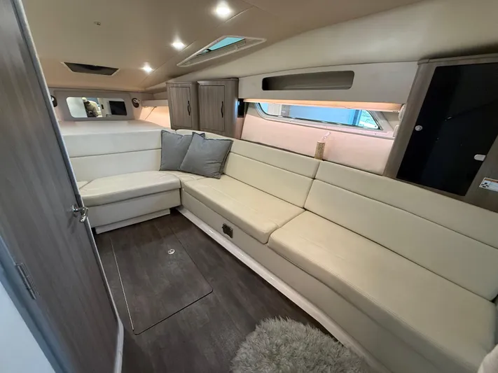 Social Distance Yacht Photos Pics 2019 Regal 35 Sport Coupe interior with beige seating and modern design.
