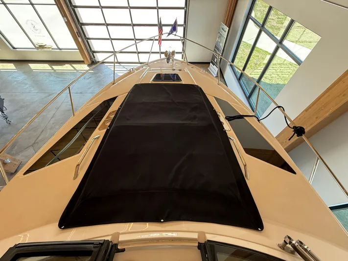 Social Distance Yacht Photos Pics 2019 Regal 35 Sport Coupe yacht in showroom, top view of deck and sunroof.