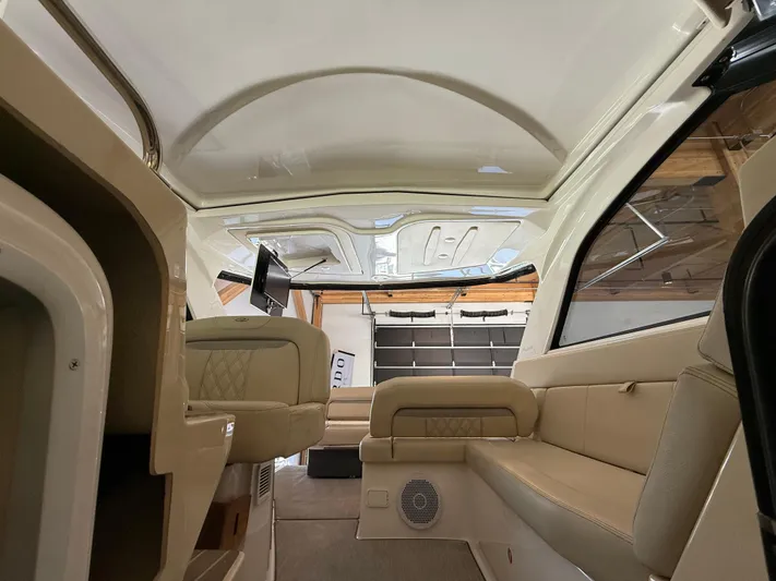 Social Distance Yacht Photos Pics Interior of a 2019 Regal 35 Sport Coupe with beige seating and modern design.