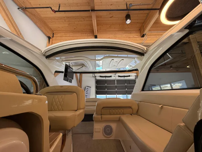 Social Distance Yacht Photos Pics Interior of a 2019 Regal 35 Sport Coupe with luxurious beige seating and modern design.