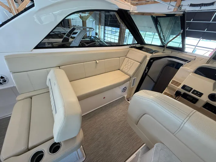 Social Distance Yacht Photos Pics 2019 Regal 35 Sport Coupe interior with beige seating and modern dashboard.