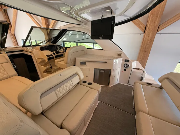 Social Distance Yacht Photos Pics Luxurious interior of 2019 Regal 35 Sport Coupe with beige seating and modern amenities.
