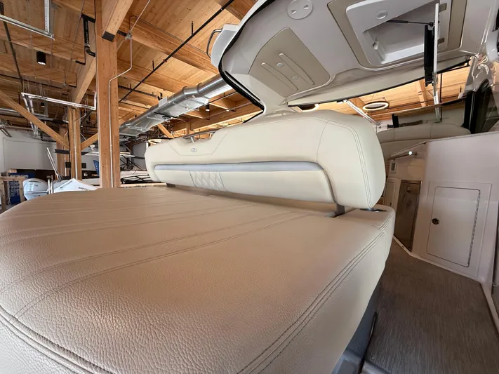 Social Distance Yacht Photos Pics 2019 Regal 35 Sport Coupe interior with beige leather seating in a wooden ceiling setting.