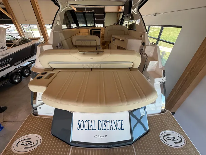 Social Distance Yacht Photos Pics 2019 Regal 35 Sport Coupe boat with "Social Distance" sign, interior view.