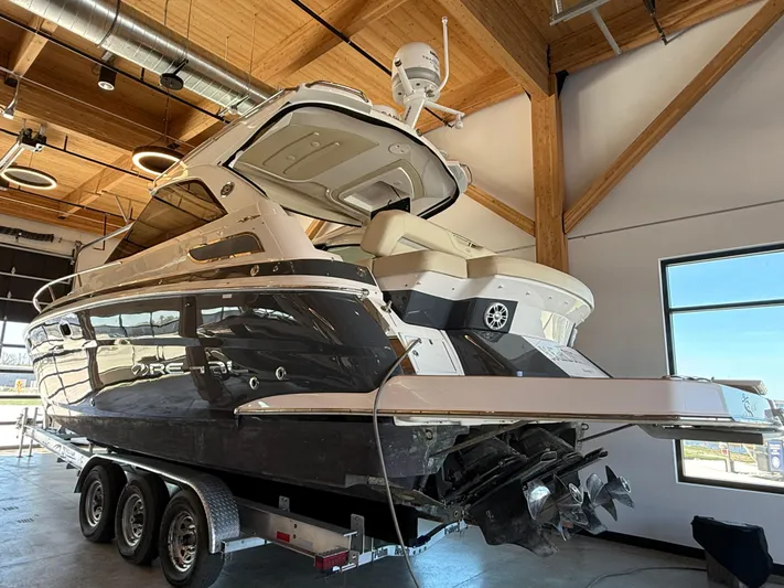 Social Distance Yacht Photos Pics 2019 Regal 35 Sport Coupe boat on trailer in indoor storage.