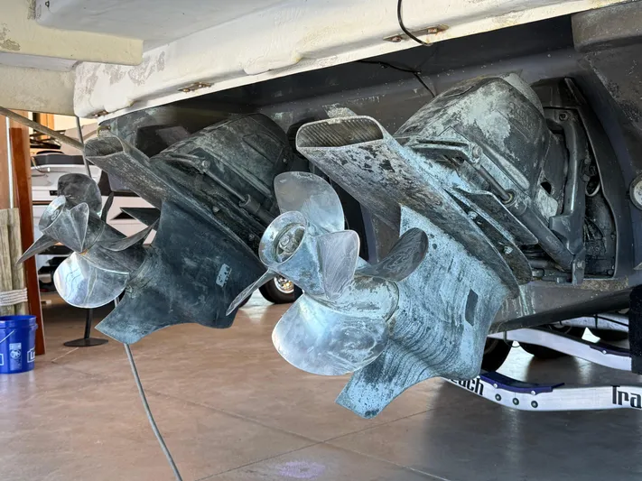 Social Distance Yacht Photos Pics 2019 Regal 35 Sport Coupe boat propellers in a garage setting.