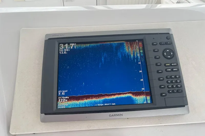 Our Trade II Yacht Photos Pics Garmin GPS display on 1996 Ocean Yachts 48 Super Sport, showing depth and speed data.