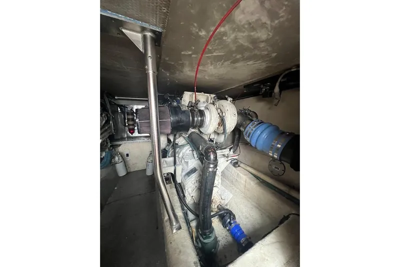 Our Trade II Yacht Photos Pics Engine room of 1996 Ocean Yachts 48 Super Sport, showcasing mechanical components and piping.