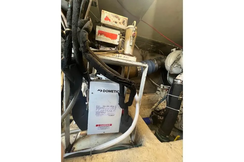 Our Trade II Yacht Photos Pics Engine room of 1996 Ocean Yachts 48 Super Sport with Dometic equipment.