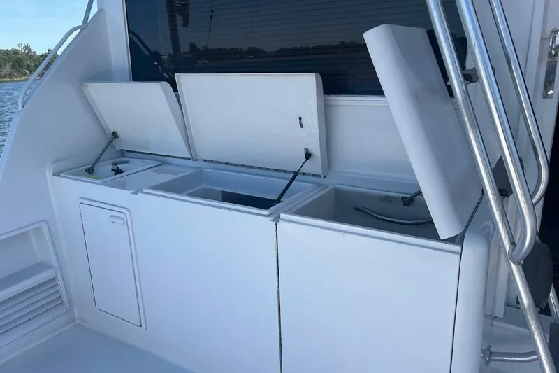 Our Trade II Yacht Photos Pics Open storage compartments on a 1996 Ocean Yachts 48 Super Sport boat deck.