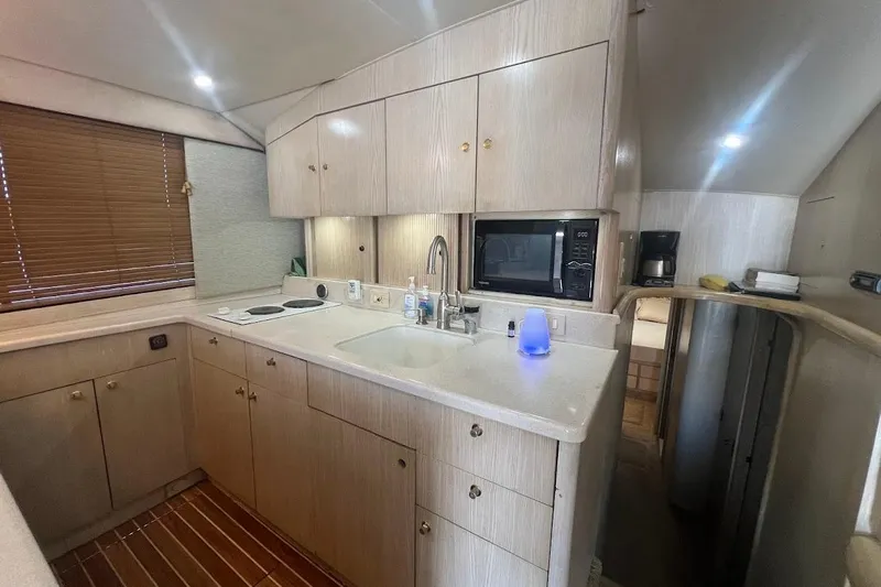 Our Trade II Yacht Photos Pics Interior of 1996 Ocean Yachts 48 Super Sport, featuring a modern kitchen area.