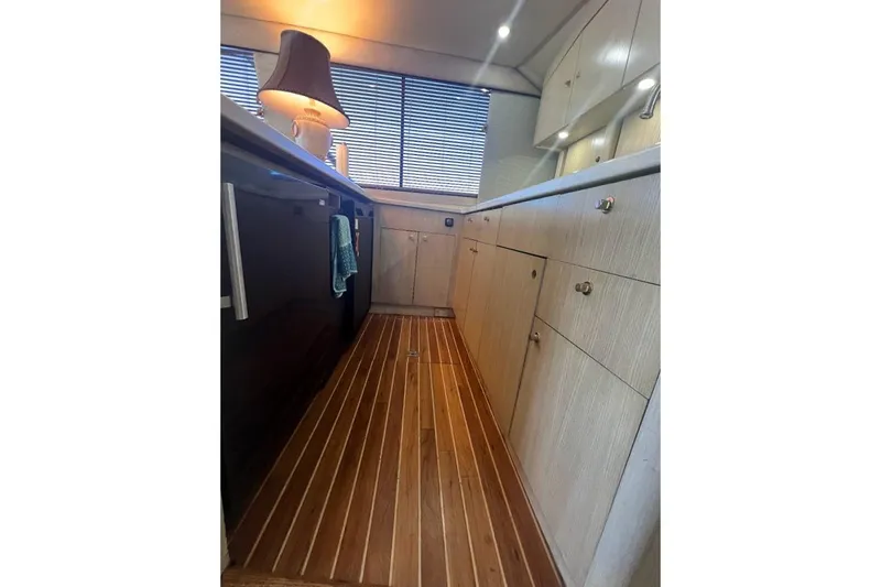 Our Trade II Yacht Photos Pics Interior of 1996 Ocean Yachts 48 Super Sport with wood flooring and modern cabinetry.