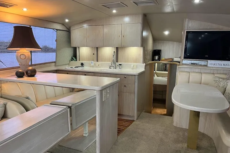 Our Trade II Yacht Photos Pics Luxurious interior of 1996 Ocean Yachts 48 Super Sport with modern kitchen and cozy seating.