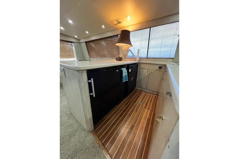 Our Trade II Yacht Photos Pics Interior of 1996 Ocean Yachts 48 Super Sport with wooden flooring and modern cabinetry.